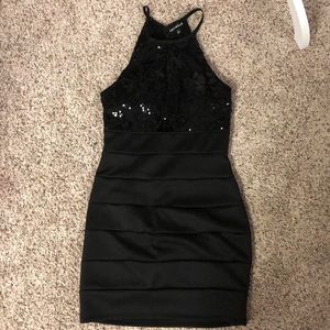 Gorgeous sequined (top) dress w/peek a boo. Halter